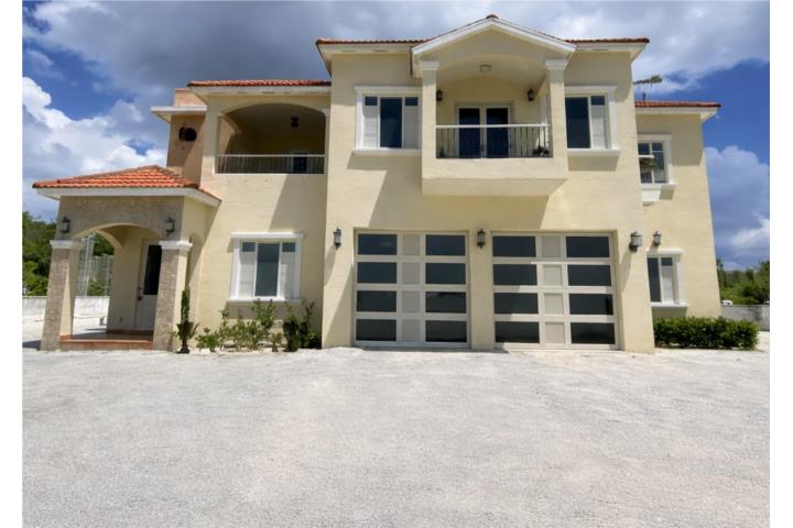 This refined Mediterranean-style residence is set within one of the most exclusive and elevated comm