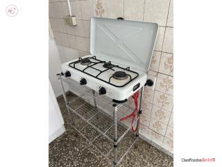 Estufa, tanque, regulador y 