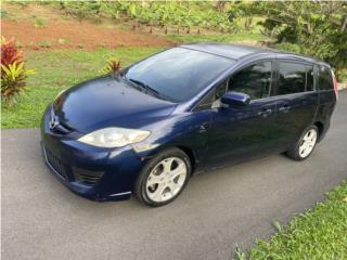 Mazda Puerto Rico Aire marbete tres filas de asientos 