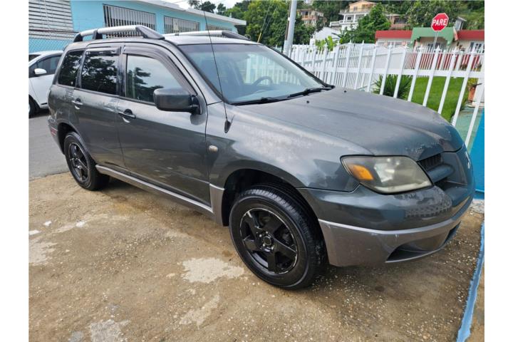 Outlander 2003 se vende o se cambia por Zuma
