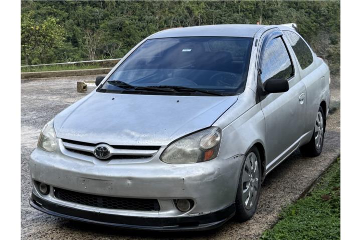 Toyota Echo gris, marbete, std