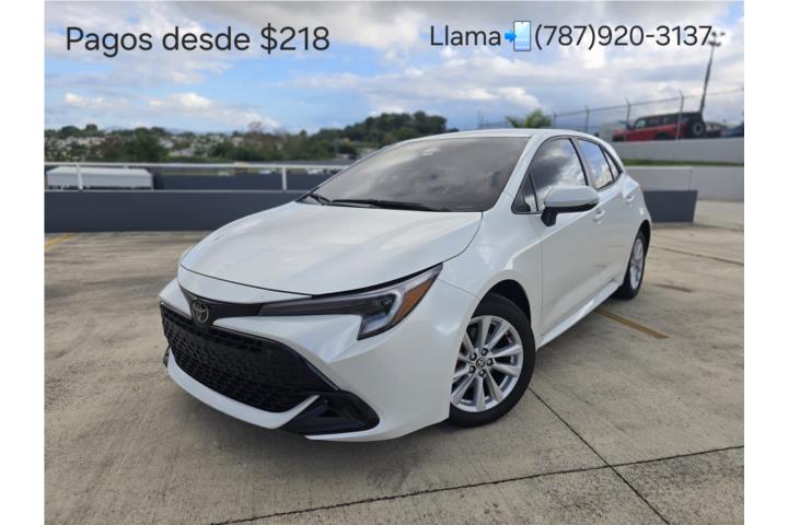 Corolla HB con 23k millas Llama (787)920-3137