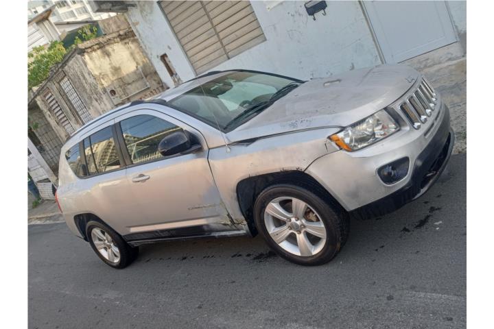 Jeep compass buen estado 21,000 millas origin