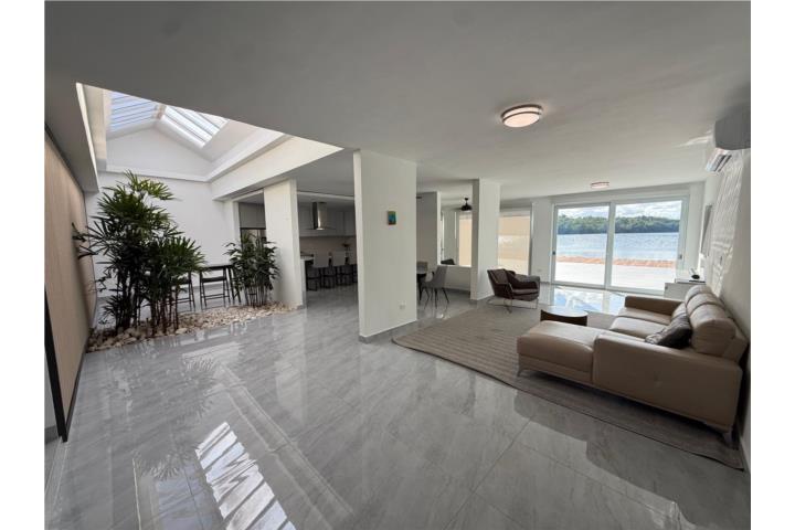 Discover a beautifully designed single-story home in the exclusive, guard-gated community of Vistamar Marina Este.