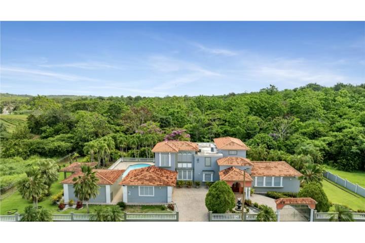 Experience refined Caribbean living in this luxurious two-story residence featuring: Spacious interi