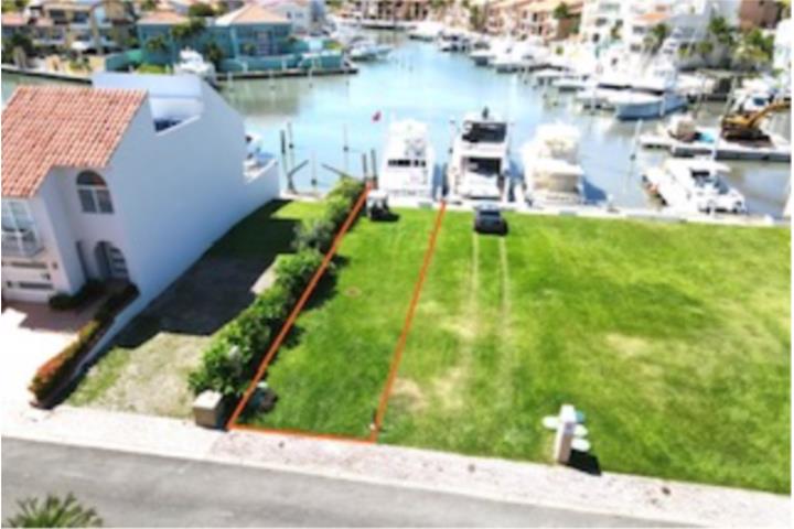 Prime Waterfront Lot with Dock – Build Your Dream Home! Discover the perfect canvas for your dream home on this 165.