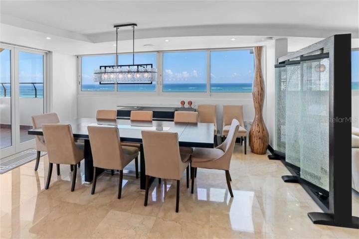 Positioned directly on one of Puerto Rico’s widest and most pristine white-sand beaches, this except