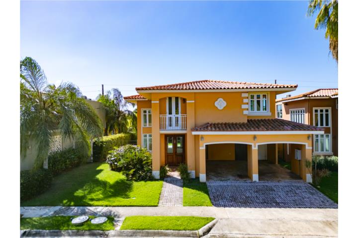 Nestled in the quiet, gated community of Grand Palm I, this beautiful two-story home is just minutes