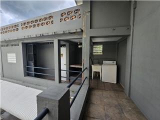 Edificio comercial con unidades de vivienda